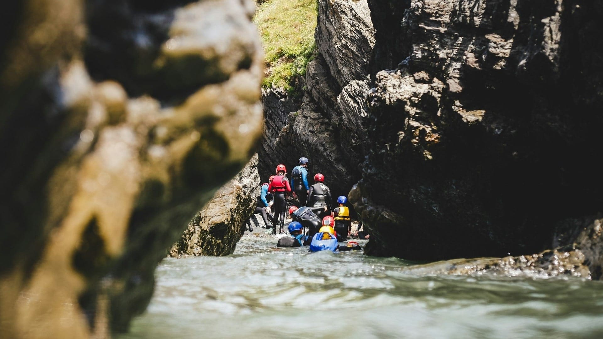 A group of people coasteering.
