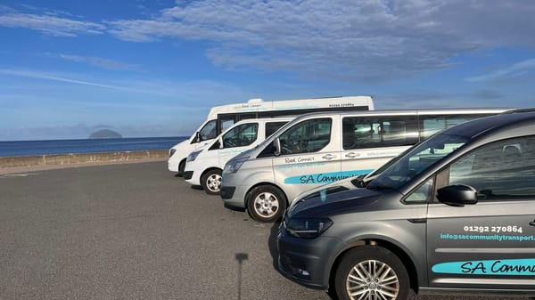 Picture of SACT Vehicles parked up on the promonade looking out towards the Ailsa Craig.